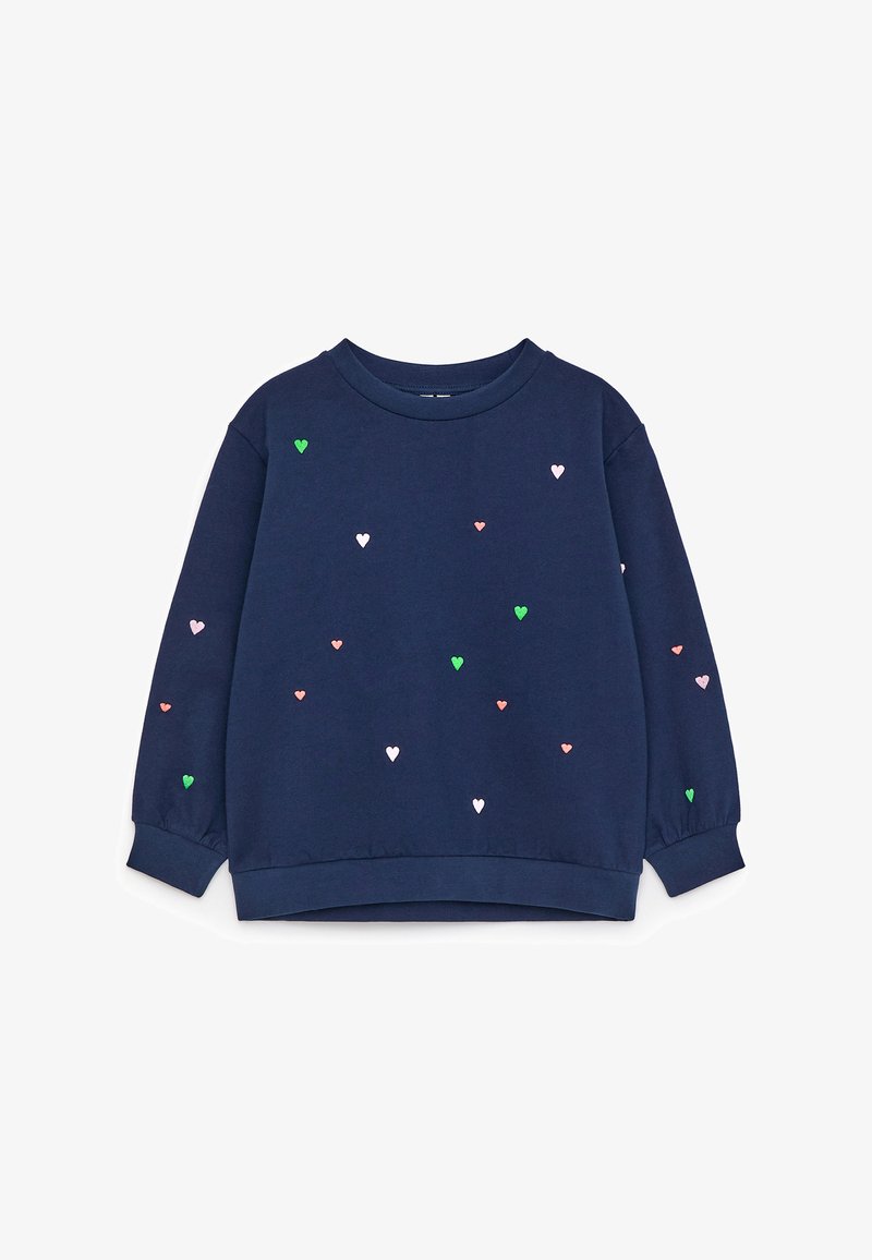 Sweat-shirt bleu marine à manches longues avec petits motifs de cœurs roses, verts et blancs éparpillés, col rond, poignets et ourlet côtelés.