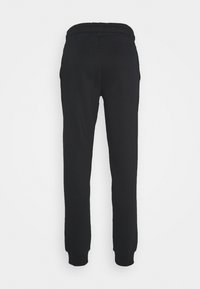 Schwarze Jogginghose mit tailliertem Design, elastischem Bund und gerippten Bündchen, aus weichem, dehnbarem Stoff. Keine sichtbaren Taschen.