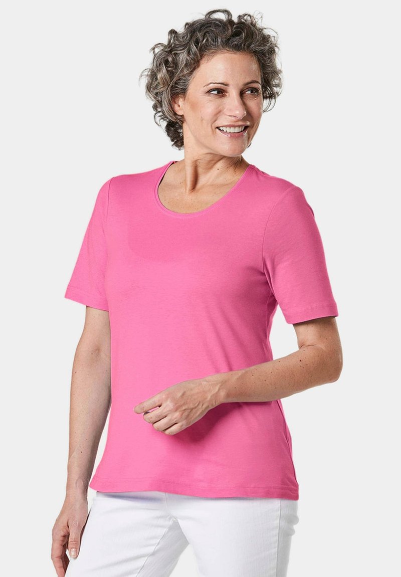 Rosa T-Shirt mit kurzen Ärmeln und Rundhalsausschnitt, aus glattem Baumwollmaterial, bietet eine lockere Passform und einen geraden Saum. Geeignet für die Freizeit.