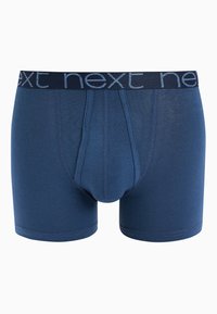 Sötétkék boxer alsónadrág sima anyagból. Kontrasztos derékpánttal rendelkezik, amelyen a "next" szó világoskék betűkkel szerepel.