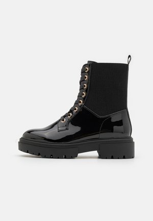 Bottines à lacets - black