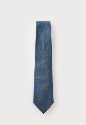 Gravata azul estreita em seda com um acabamento texturizado, apresentando padrões bordados em ouro de figuras em movimento espalhados por toda a superfície.
