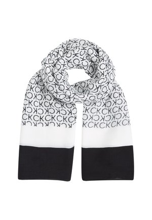 Sciarpa bianca con lettere nere ripetute lungo tutta la lunghezza, che si fondono in una sezione nera uniforme nella parte inferiore. Tessuto leggero, texture liscia.