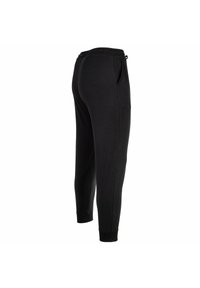 Černé joggingové kalhoty s elastickým pasem a šňůrkami. Mají dvě postranní kapsy a zúžené manžety na kotnících. Měkká textilie.
