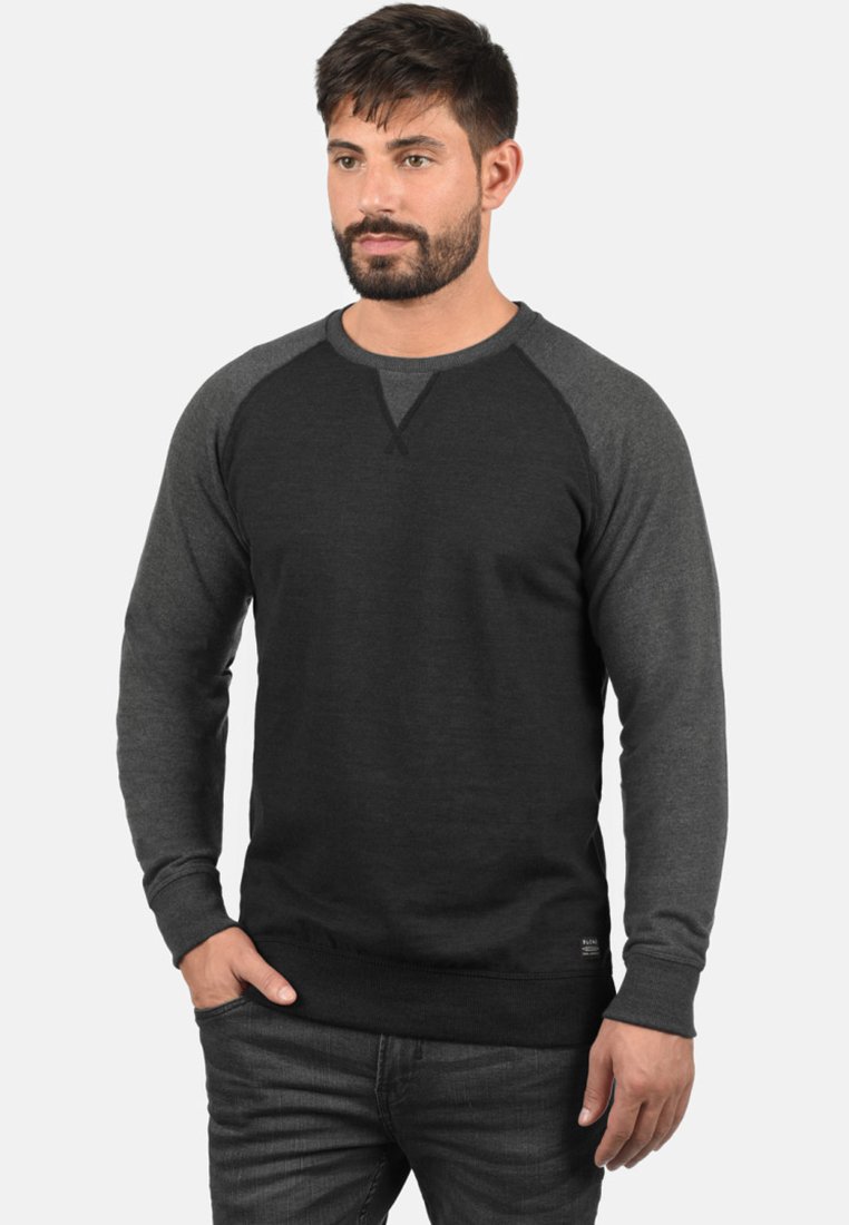 Felpa da uomo con design raglan, in due tonalità di grigio, maniche lunghe e orlo a costine. Tessuto morbido con un fit classico.