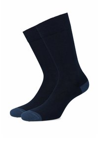 Granatowe skarpetki o gładkiej fakturze, z kontrastowymi niebieskimi akcentami na palcach i pięcie. Żebrowany mankiet zapewniający pewne dopasowanie.