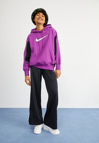 Nike Sportswear PANT - Tracksuit bottoms - black/white