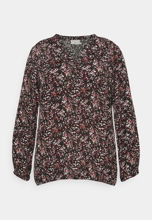 Musta lilleline pluus väikeste roosa, valge ja rohelise mustritega. Omab V-kujulist kaelust ja pikki, kogutud varrukasid. Valmistatud kergest kangast.