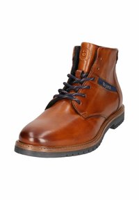 Brown leather ankle boot featuring a round toe, navy laces, and stitched detailing. Rubber sole with textured grip for durability.