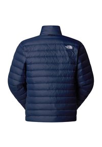Giacca imbottita blu navy con motivo trapuntato, colletto alto e dettaglio del logo sul retro in alto a sinistra. Texture del materiale liscia e lucida.
