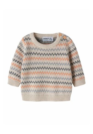 Pull bébé beige en maille avec des rayures zigzag orange, noires et bleues et deux boutons en bois sur l'épaule.