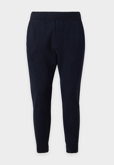 Pantalon fuselé bleu marine foncé avec taille et poignets élastiques, deux poches latérales, conçu pour un port décontracté confortable.