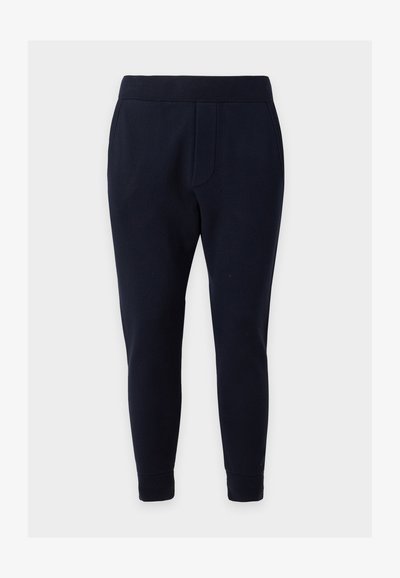 Pantalon fuselé bleu marine foncé avec taille et poignets élastiques, deux poches latérales, conçu pour un port décontracté confortable.