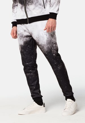 Mr. GUGU & Miss GO SPACE SMILE  - Pantalones deportivos - black