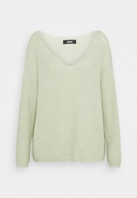 Pull vert clair en tricot à manches longues avec un col en V et une texture côtelée, étiquette ZIGN à l'intérieur du col.