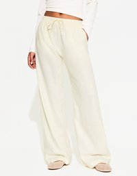 WITH AN ELASTICATED WAISTBAND - Hlače - light yellow