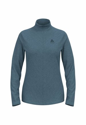 Langarmtop in blauw-grijze gestructureerde stof, met een hoge kraag en een subtiel chevronpatroon. Logo op de borst weergegeven.