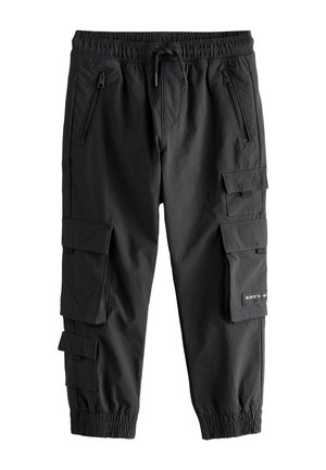 Schwarze Cargo-Hosen mit elastischem Bund, Kordelzug, mehreren Utility-Taschen und eng anliegenden Bündchen. Hergestellt aus leichtem Stoff mit glatter Textur.