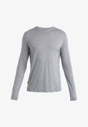 Langsleeve shirt gemaakt van lichtgewicht, zachte grijze stof met een ronde halslijn en een subtiele textuur. Voorzien van een zijlabel.