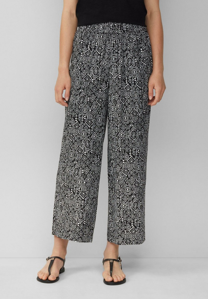 Zwart-witte patroon wijde broek met een elastische tailleband, voorzien van geometrische ontwerpen en een lichtgewicht, vloeiende stof.