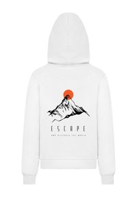 White hoodie with a drawstring hood. Back features a black mountain graphic and an orange sun, with the text "ESCAPE AND DISCOVER THE WORLD."