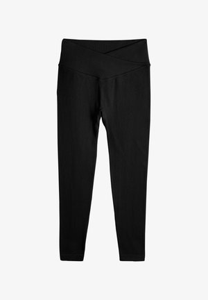 Mustad ribad leggings laiad, ristatud vöökoht ja sobivad jalad. Valmistatud elastsest kangast mugavuse ja paindlikkuse tagamiseks.
