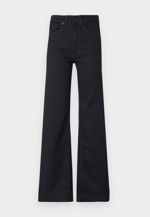Schwarze Bootcut-Jeans aus Denim mit hoher Taille, fünf Taschen und dezenten Steppnähten. Strukturierter Stoff mit glatter Oberfläche.