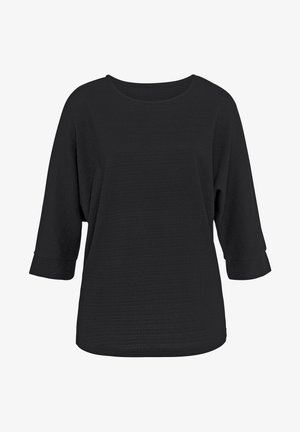 Čierny oversized top s širokým okrúhlym výstrihom, trojštvrťovými rukávmi a štruktúrovanou látkou, s voľným strihom a zakriveným lemom.