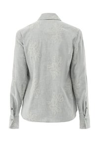 Light gray long-sleeve shirt with embroidered floral pattern. Features a collar and buttoned cuffs. Textured fabric with a soft finish.