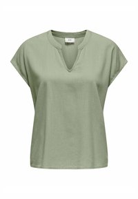 Ljust grön kortärmad blus med V-ringning och avslappnad passform. Tillverkad av ett texturerat tyg med en slät finish.