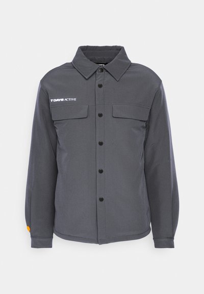 Gray button-up jacket with a collar, two front pockets, and black buttons. Features an orange accent on the sleeve. Made of durable fabric.