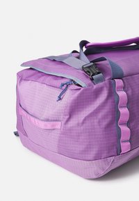 Purple and lavender large duffel bag with side zipper pocket, gray straps, and black plastic buckle on white background.