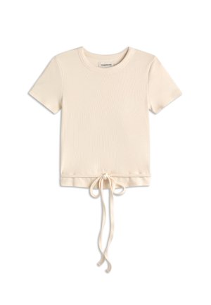 Top crema a maniche corte in maglia a costine con scollo rotondo e dettaglio annodato sul davanti che pende dall'orlo.