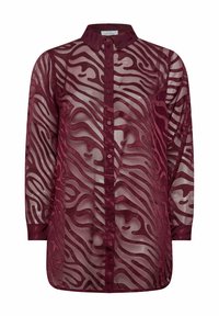 Långärmad skjorta i vinröd, tillverkad av genomskinligt tyg med abstrakta vågmönster. Den har en knappupplåsning fram och en klassisk krage.