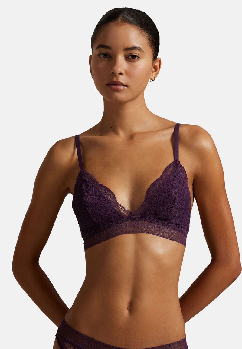 Violetti pitsirintaliivit ohuilla olkaimilla, V-kaula-aukolla ja pehmeällä, teksturoidulla nauhalla, jossa kohokuvioitu brändin nimi.