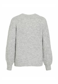 Ljust grått stickat tröja med en kubformad silhuett, långa ballongärmar och rund halsringning. Texturerat tyg utan synliga knäppningar.