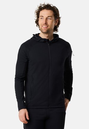 Zwarte zip-up hoodie met een gladde textuur, voorzien van een slim fit ontwerp, raglanmouwen en twee zijzakken.