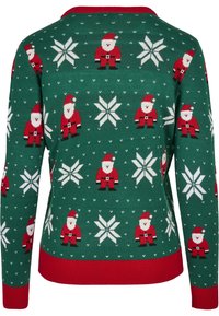 Pull de Noël vert avec motif répétitif de figures du Père Noël pixelisées et flocons de neige blancs, poignets et col rouges.