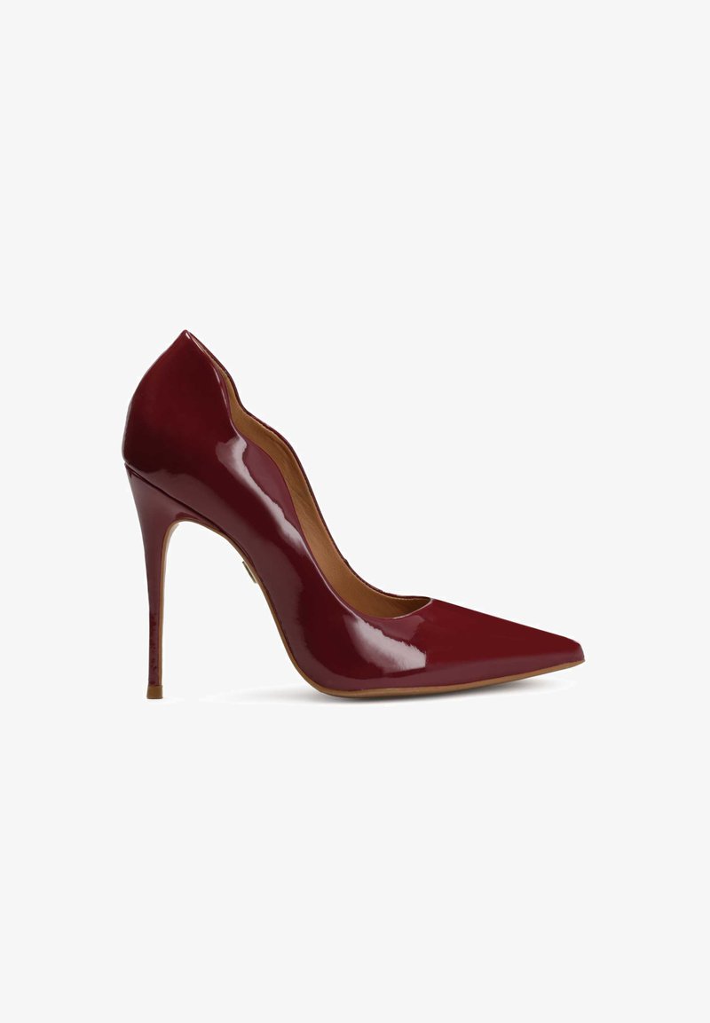 Red patent leather high heel shoe with a pointed toe and a sleek, curvy design. Features a slim stiletto heel for elevated height.
