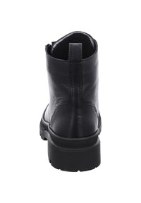 Bottines noires en cuir avec une finition texturée, un bout rond et une semelle en caoutchouc durable. Comprend une languette à l'arrière pour un enfilage facile.
