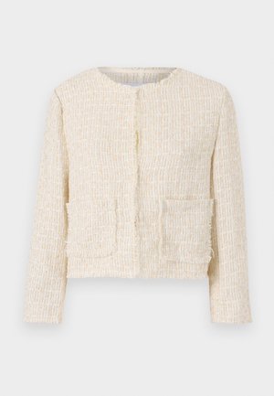 Textūruota grietinėlės spalvos striukė su apvalia iškirpte, dviem priekinėmis kišenėmis ir nubyrėjusiomis briaunomis. Prisiūtas, trumpas modelis su ilgomis rankovėmis.