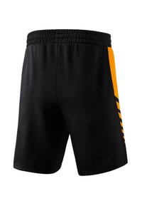 Pantaloni sportivi neri con elastico in vita, caratterizzati da un pannello laterale con un accento giallo e una leggera texture su tutta la superficie.