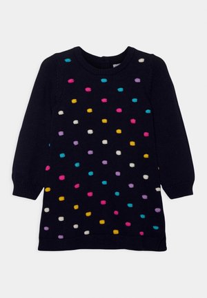 Pull en maille bleu marine à manches longues avec des pois en relief multicolores rose, jaune, blanc, violet et sarcelle, col rond.