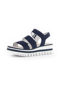 Marineblauwe sandalen met drie stoffen riemen, open teen, witte platformzool met een zwarte streep en gestructureerde ribbels voor grip.