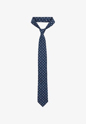 Granatowy krawat z materiału, zdobiony powtarzającym się wzorem kwiatów w bieli i jasnym niebieskim. Smukły krój z szpiczastym końcem i płaskim kołnierzykiem.