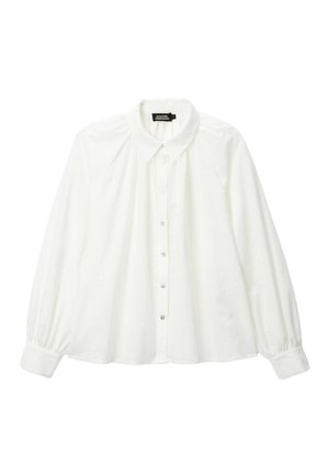 Blouse blanche à manches longues avec boutons, manches bouffantes, texture florale subtile et col Peter Pan, taille petite.