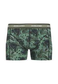 Green boxer shorts with a black tropical leaf pattern, featuring a branded elastic waistband in olive green and a fitted design.