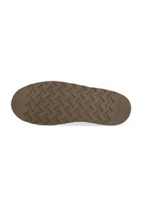 Suela de un zapato marrón con un patrón de banda de rodadura en zigzag y el nombre de marca "SHABBIES" grabado cerca del talón.