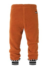 Orange fleecebukser med en blød tekstur, der har sorte og hvide stribede ribkanter og et lille mærkelogo på bagsiden.