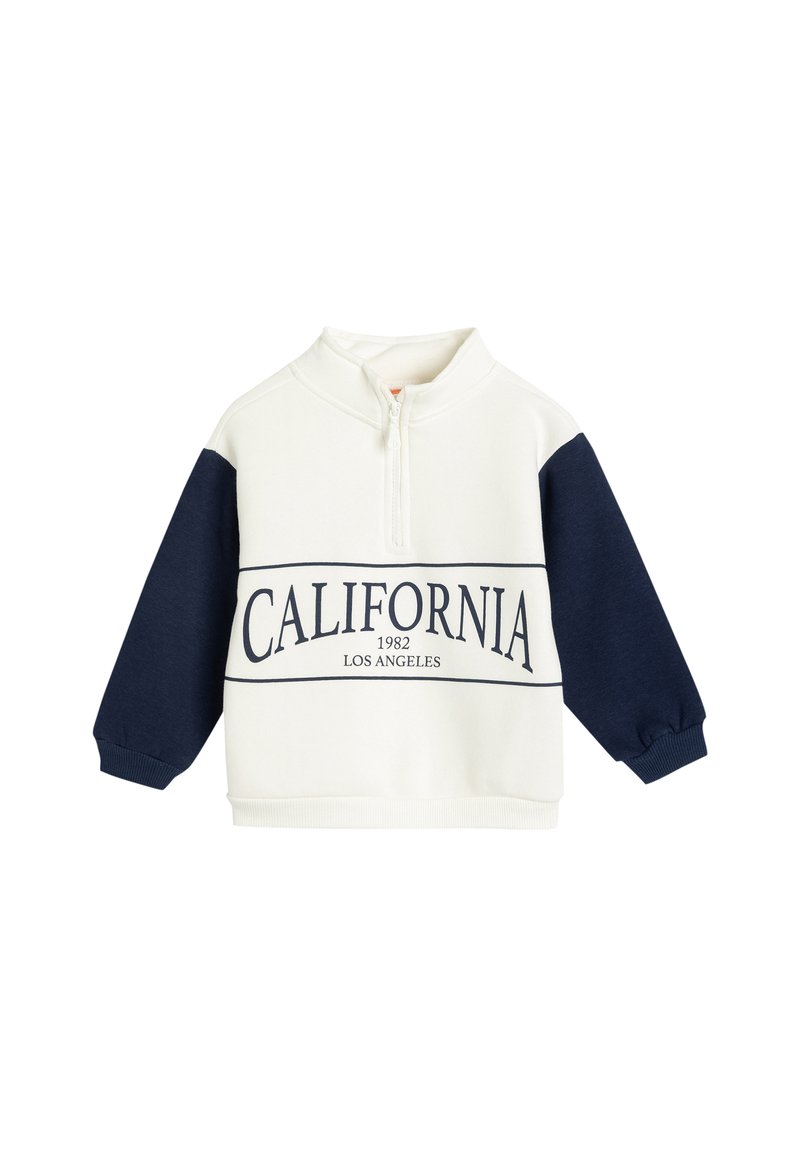 Sweatshirt blanc et marine avec un col zippé à moitié, présentant l'inscription "CALIFORNIA 1982 LOS ANGELES" imprimée sur le devant en lettres majuscules.
